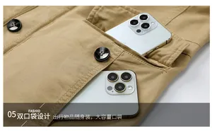 Close-up of khaki cotton jacket showing dual large utility pockets with phone storage