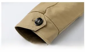 Detailed macro view of khaki cotton jacket cuffs with adjustable button straps