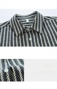 Detail of cotton striped shirt featuring black and white chevron pattern and white buttons