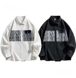 Detail of men's long sleeve shirt featuring zebra print patchwork and honeycomb texture