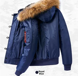 Detail of royal blue MA1 flight jacket showing thick faux fur collar and arm pocket ribbon