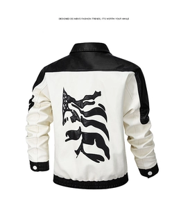 Detail view of the back of a black and white PU leather jacket with abstract embroidery