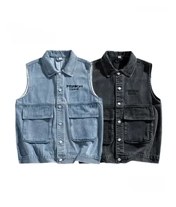 Detail view of the shirt collar and flap pockets on this retro denim utility vest