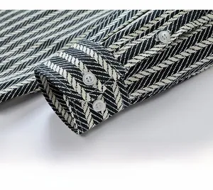 Close-up of cotton striped shirt cuff with three white buttons and detailed weave texture