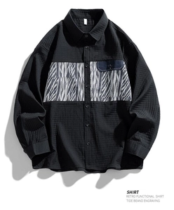 Detail of waffle knit fabric and abstract textured panel on long sleeve shirt