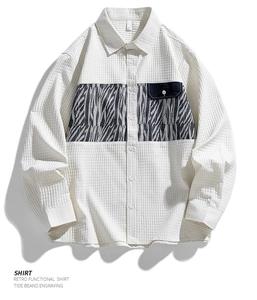 Detailed close-up of cream waffle fabric long sleeve shirt with zebra stripe pocket detail