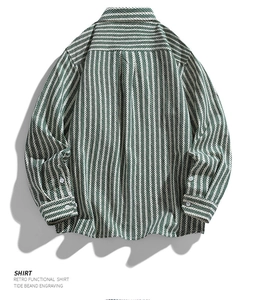 Detailed back view of green and white herringbone striped cotton shirt with yoke stitching