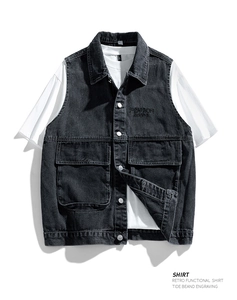 Detailed macro view of retro black denim cargo vest with metallic buttons and flap pockets