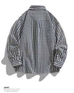 Detail view of cotton herringbone shirt back with functional double pleats