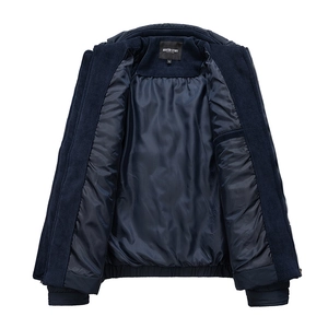 Detailed view of navy blue jacket with ribbed collar, brand label, and smooth inner lining