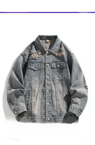Close-up of distressed vintage denim jacket showing metal buttons and worn texture detail