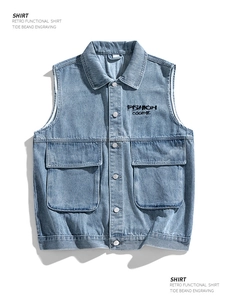 Detailed view of blue denim vest featuring utility pockets and fashion embroidery