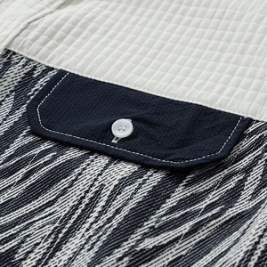Men's casual long sleeve shirt featuring beige quilted plaid and navy blue patchwork