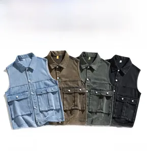 Flat lay of vintage denim vests in light blue, brown, olive green, and dark grey black