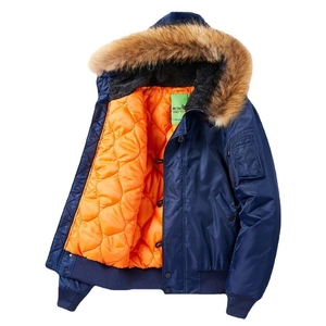 Classic navy blue MA1 bomber jacket with quilted orange lining and detachable fur hood