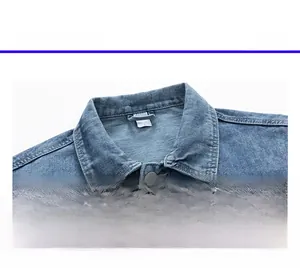 Detailed macro view of denim jacket collar with size L tag and metallic JEANS button