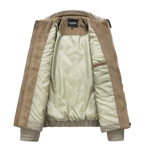 Detail of khaki corduroy jacket showing smooth inner lining and neck label branding