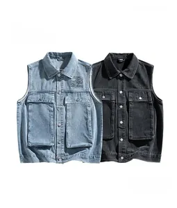 Detailed view of cargo pockets and lettering on washed denim functional vest