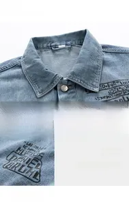 Detailed macro view of vintage wash denim fabric and retro American style letter print