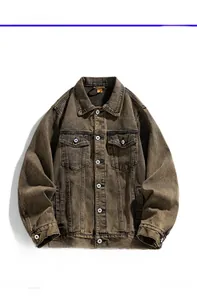 Detailed close-up showing the vintage brown washed denim fabric and front chest pocket