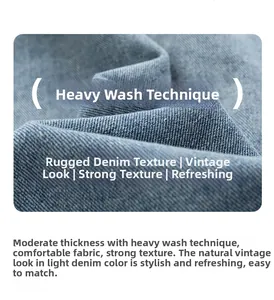Detail of heavy enzyme washed denim fabric with a coarse texture and light blue retro finish
