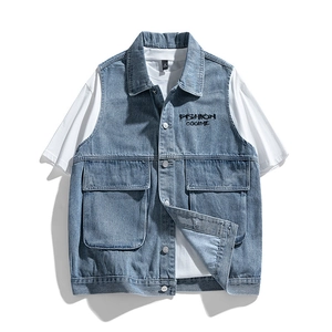 Mens vintage washed blue denim vest layered over a white t-shirt in a flat lay style