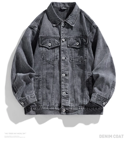 Detailed view of grey washed denim jacket featuring classic collar and metal buttons