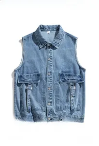 Detailed view of light blue denim vest with classic collar and metal button pockets