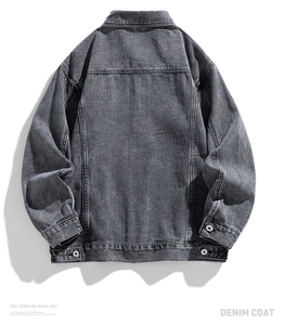 Rear view detail of loose fit dark grey vintage washed denim jacket with premium textures