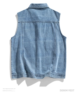 Detail view of light blue denim vest back featuring classic stitching and washed texture