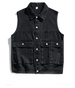 Detailed view of black denim utility vest featuring silver buttons and large flap pockets