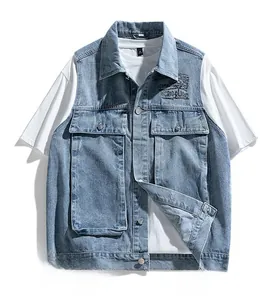Detail of light blue washed denim vest featuring utility pockets and letter print design