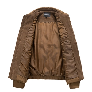 Detail of men's brown corduroy jacket showing smooth satin lining and brand neck label