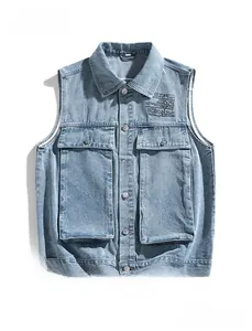Detail of vintage light blue denim vest with functional cargo pockets and metal buttons