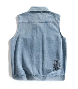 Detail view of washed denim vest back with black text print and stylish seam stitching