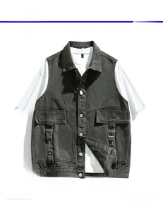 Detail view of washed grey denim vest with utility pockets and metal D-ring straps