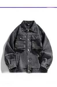 Detail of vintage washed gray denim jacket with metallic buttons and flap chest pockets