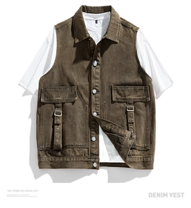 Detail of a brown washed denim vest featuring oversized chest pockets and metal buttons