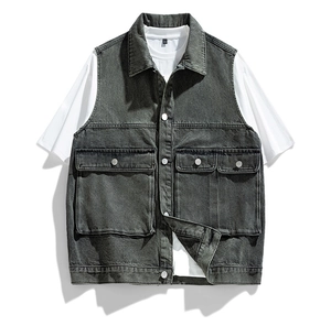 Detailed view of dark grey washed denim vest featuring flap pockets and metal buttons