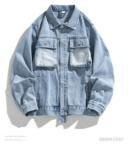 Flat lay of light blue washed denim jacket featuring classic collar and symmetrical pockets