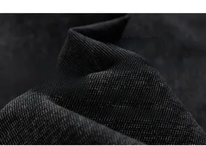 Vue macro détaillée du tissu en sergé de coton noir épais avec texture de tissage