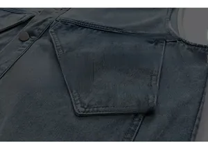 Close-up of industrial denim vest with double pockets and premium stitching details