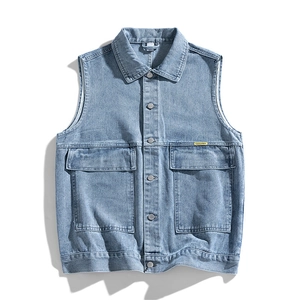 Flat lay of a light blue denim vest for men with cargo pockets and retro washed cotton fabric
