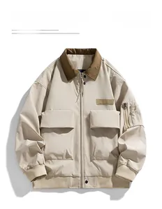 Detail of khaki cargo jacket featuring brown corduroy collar and functional utility pockets