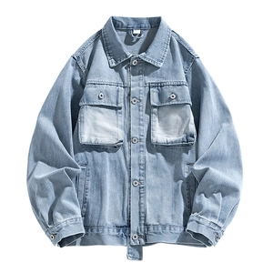Vintage light blue washed denim jacket with cargo pockets and classic metal button closure