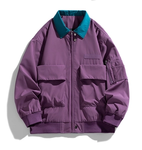 Flat lay of purple utility jacket with teal collar and large cargo pockets detail