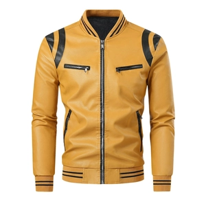 Detail view of ginger yellow PU leather jacket with black ribbed collar and shoulder patches