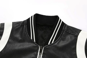Detailed close-up of ribbed baseball collar and plush faux fur lining on a PU leather jacket