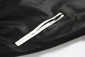 Detail of high-quality black PU leather texture with contrast white zipper track