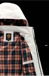 Close-up of hooded jacket collar with brown plaid lining and size L brand label